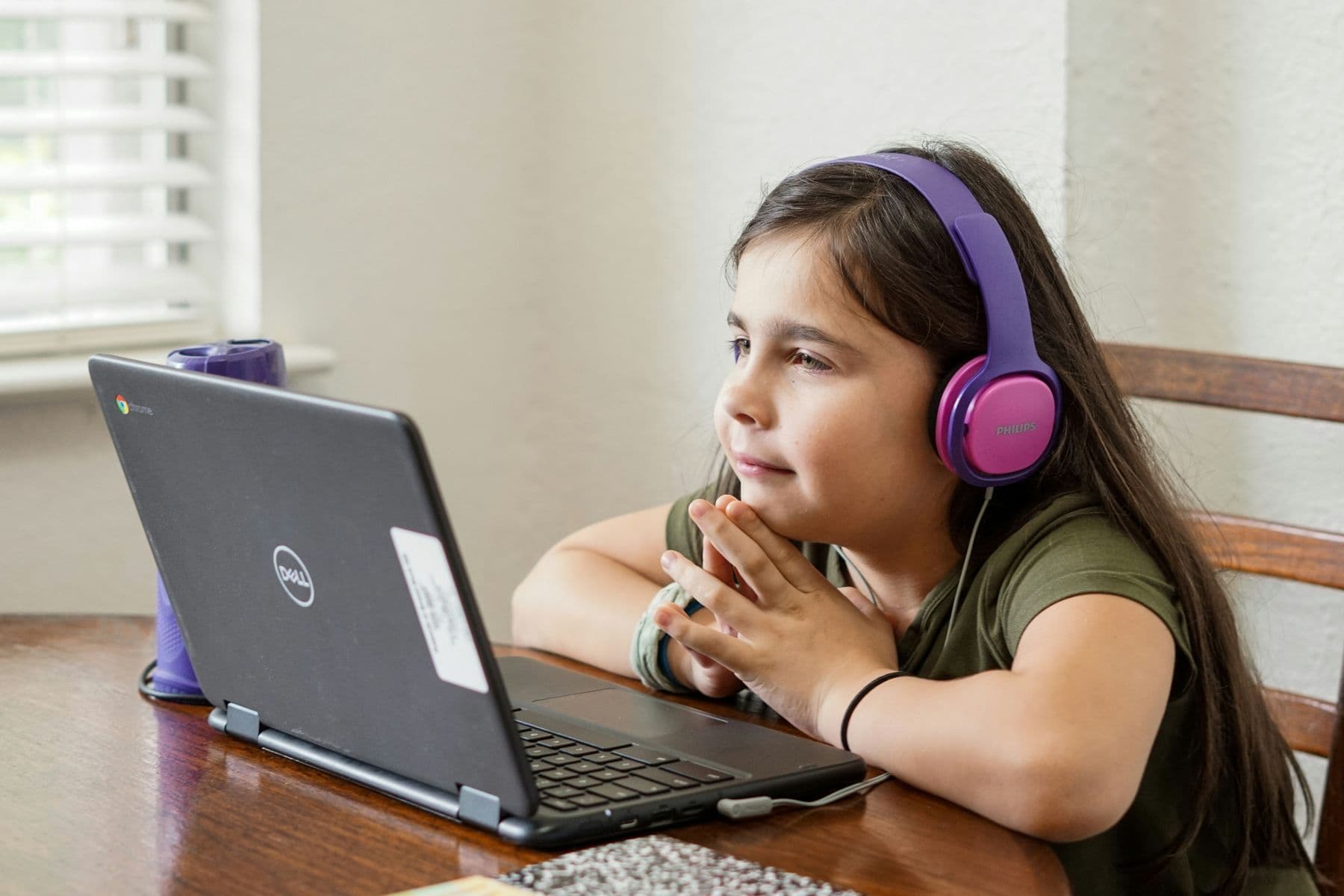 A child working through an online lesson at home
